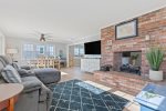 Cozy sitting room at the front of the home that opens to the dining area