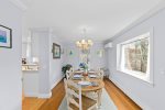 A large picture window by the dining table for natural light