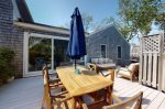 Expansive deck with an outdoor dining table and lounge area