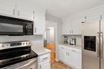 Stainless steel appliances and an adorable coffee bar