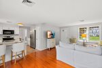 The kitchen opens to an additional sitting room