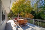 Sprawling back deck with outdoor dining