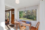 Intimate dining nook with a picture window