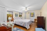 Primary bedroom with door to the front yard