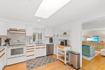 A fully stocked kitchen with a coffee cart