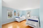 Main level bedroom with two twin beds