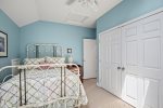 Bedroom located on upper level with full-size bed 
