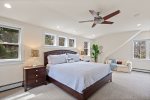 Bright, spacious primary bed Situated in a separate section of the house at the top of a private staircase. king-size bed, large walk-in closet, sitting area with a desk and 50 Smart TV 