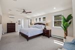 Bright, spacious primary bed Situated in a separate section of the house at the top of a private staircase. king-size bed, large walk-in closet, sitting area with a desk and 50 Smart TV 
