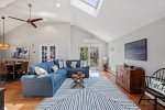 open layout sitting area with picture framed 55 Smart TV
