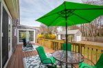 Bask in the sun or relax in the shade of the umbrella on the newly renovated deck
