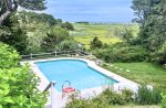 Spacious Cape Cod vacation home with pool, fenced-yard and water views near Nauset Beach