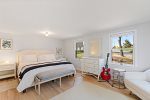 Primary bedroom with king bed located on main level