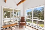 Calm sitting area with panoramic view of the marsh. Perfect for winding down or reading