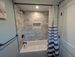 Downstairs bathroom with tub / shower combo