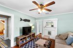 Stylish and comfortable living room featuring a flat-screen TV and games, ideal for family gatherings on Cape Cod