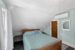Comfortable second-floor queen bedroom in your Harwich vacation home, perfect for unwinding during your Cape Cod stay