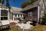 Relax and dine outdoors on this coastal-inspired crushed-shell patio, seating six guests at your Harwich vacation home