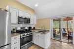 Well equipped kitchen with modern amenities and stainless steel appliances