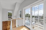 Expansive windows invite in Cape Cod Bay light and sea breezes.