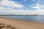 Expansive low-tide flats at Mayo Beach, perfect for walks, shelling, and sunsets.