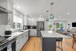 Sleek kitchen with stainless steel appliances and a spacious center island.