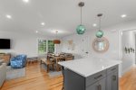 Seamless flow from kitchen to dining and living areas creates easy vacation living.
