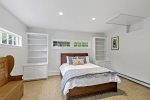 First-floor bedroom with a comfortable queen bed and plenty of natural light  ideal for restful nights on the Cape