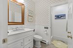 First-floor full bathroom with walk-in shower, perfect for guests seeking accessibility and comfort