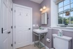 Handy half bath off the upper living area, perfect for quick breaks between deck time and dinner.