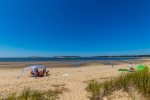 Family-friendly bayside beach with soft sand and shallow water, perfect for kids and sunset walks near Chipmans Cove Lookout.