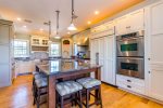Second-floor kitchen with peninsula seating, stainless appliances, and plenty of prep space for Wellfleet oysters and Cape Cod seafood dinners.