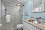 First-floor bathroom with modern vanity and shower conveniently located for guests staying in this Centerville rental.