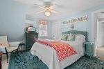Second-floor queen bedroom with soft coastal colors and reading lamps, a quiet hideaway in this Centerville Cape Cod home.