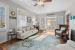 Main living room highlighting coastal dcor and open flow toward dining room in this Centerville vacation rental.