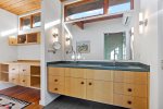 Double sink vanity with wide counter space and bright lighting, easy mornings for families and groups in Wellfleet.