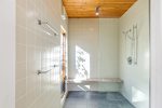 Tiled walk in shower with bench seating, spa inspired refresh after swimming and Cape Cod adventures.