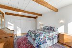 Guest bedroom with ample closet storage and bright light, comfortable Outer Cape sleeping space for your group.