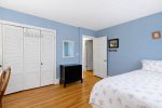 Guest bedroom with closet storage and easy hallway access, comfortable sleeping space in this Centerville vacation rental