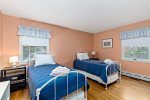 Kid friendly twin bedroom with two beds and soft light, great for families vacationing near Long Pond and beaches