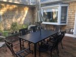 Great outdoor patio with enough setting for the whole family to enjoy a meal together 