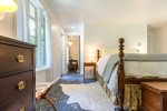 Comfortable queen bedroom with easy bath access, ideal for couples looking for a quiet, restful stay.