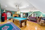 Pool table game room with fireplace and nautical decor, your private entertainment hub for evenings at home in Yarmouthport.