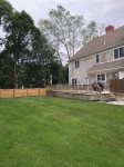 Fenced backyard with deck and grillperfect for al fresco dinners, kids and dogs, and easy Cape Cod evenings.