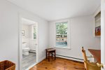 Small office nook off the hall, with natural light and easy access to the first floor half bath.