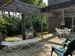Relax on the deck with hammock, lounge chairs, and shaded seating, one of many outdoor spaces to enjoy. 