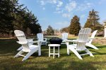 Spacious backyard with Adirondack chairs and a firepit offers the perfect setting for summer evenings under the stars.