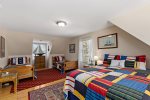Upstairs bedroom with queen and twin beds, perfect for kids, cousins, or friends traveling together to Cape Cod.