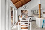 Cozy dining space beside the kitchen, thoughtfully set for dinner after a day at Marconi Beach or Wellfleet Center.
