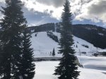 Winter view from balcony of Alpine ski area and pool